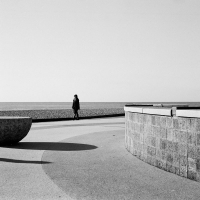 Woman walking along promanade